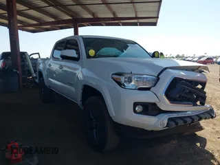 2023 Toyota Tacoma SR with VIN 3TMCZ5AN4PM608413, listed as a IAAI auction lot 42283621 with 33,252 mi miles and . Bid and sale history available at DreamBid. Image 1.