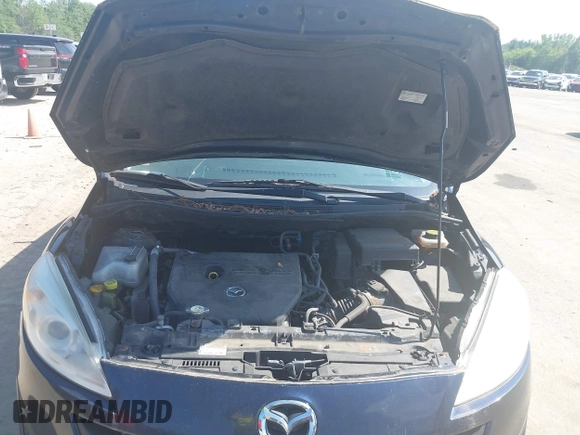 2015 Mazda 5 Sport with VIN JM1CW2BLXF0182264, listed as a IAAI auction lot 42638417 with 142,003 mi miles and . Bid and sale history available at DreamBid. Image 10.
