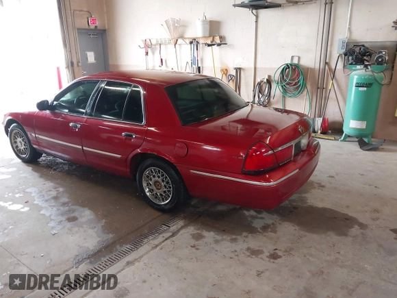 2001 Mercury Grand Marquis GS z VIN 2MEFM74W01X636957, wystawiony jako IAAI lot #42270858 z przebiegiem 181 372 mil mil oraz . Historia ofert i sprzedaży dostępna na DreamBid. Obrazek 3.