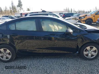2017 Chevrolet Cruze LS z VIN 1G1BC5SM5H7277073, wystawiony jako IAAI lot #41336306 z przebiegiem 95 515 mil mil oraz . Historia ofert i sprzedaży dostępna na DreamBid. Obrazek 14.