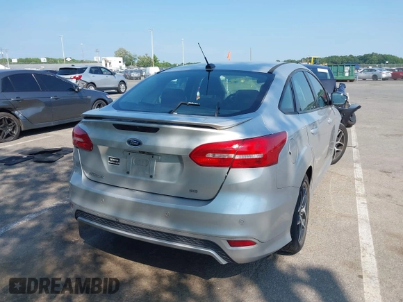 2015 Ford Focus SE with VIN 1FADP3F25FL381008, listed as a IAAI auction lot 42413322 with 106,353 mi miles and . Bid and sale history available at DreamBid. Image 4.