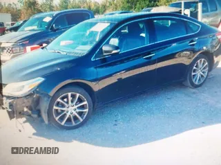 2014 Toyota Avalon Limited with VIN 4T1BK1EB4EU096164, listed as a IAAI auction lot 40904808 with 242,086 mi miles. Bid and sale history available at carsss.com. Image 2.