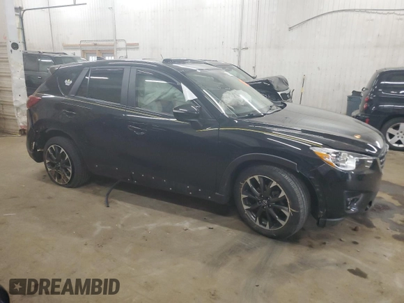 2016 Mazda CX-5 Grand Touring with VIN JM3KE4DY0G0854568, listed as a Copart auction lot 53259345 with 74,264 mi miles and Salvage Title. Bid and sale history available at carsss.com. Image 4.