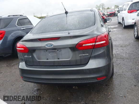 2015 Ford Focus SE with VIN 1FADP3F28FL219552, listed as a IAAI auction lot 41959648 with 128,590 mi miles. Bid and sale history available at carsss.com. Image 16.