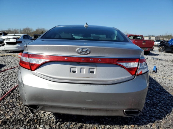 2014 Hyundai Azera с VIN KMHFG4JG6EA354742, выставлен на аукционе Copart как лот 48163345 с пробегом 104 983 миль миль и Списание • Salvage title. История ставок и продаж доступна на DreamBid. Изображение 6.