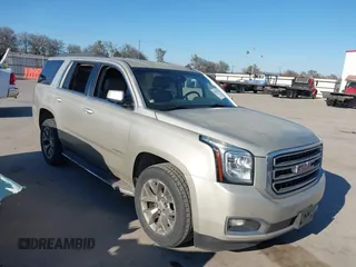 2015 GMC Yukon SLT z VIN 1GKS1BKC0FR125985, wystawiony jako IAAI lot #38778574 z przebiegiem 198 566 mil mil oraz . Historia ofert i sprzedaży dostępna na DreamBid. Obrazek 1.