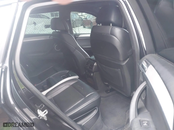 2011 BMW X6 M with VIN 5YMGZ0C57BLK14388, listed as a IAAI auction lot 41411854 with 129,248 mi miles. Bid and sale history available at carsss.com. Image 8.