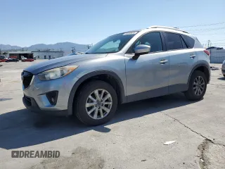 2014 Mazda CX-5 Touring with VIN JM3KE2CY4E0337826, listed as a Copart auction lot 52052025 with 236,934 mi miles and Salvage title. Bid and sale history available at DreamBid. Image 1.