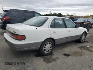 1994 Toyota Camry XLE with VIN JT2GK13E5R0008509, listed as a Copart auction lot 76014164 with 188,427 mi miles and Salvage Title. Bid and sale history available at carsss.com. Image 3.