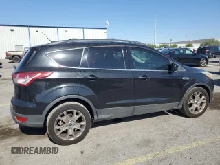 2013 Ford Escape SE with VIN 1FMCU0GX8DUA38056, listed as a Copart auction lot 57617885 with 128,467 mi miles and Salvage title. Bid and sale history available at DreamBid. Image 3.
