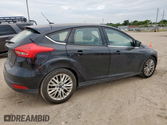 2018 Ford Focus Titanium z VIN 1FADP3N2XJL289659, wystawiony jako Copart lot #65594275 z przebiegiem 115 739 mil mil oraz Czysty tytuł • Clean title. Historia ofert i sprzedaży dostępna na DreamBid. Obrazek 3.