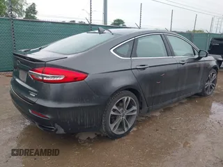 2020 Ford Fusion Titanium with VIN 3FA6P0K97LR192657, listed as a IAAI auction lot 42170258 with 87,696 mi miles and . Bid and sale history available at DreamBid. Image 4.