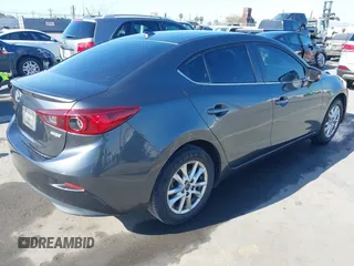 2016 Mazda Mazda3 i Grand Touring with VIN JM1BM1X79G1278079, listed as a IAAI auction lot 42010729 with 104,797 mi miles. Bid and sale history available at carsss.com. Image 4.