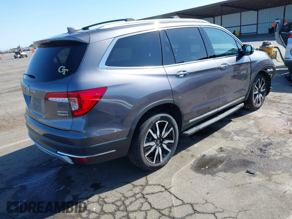 2021 Honda Pilot Touring 8-Passenger with VIN 5FNYF6H97MB034399, listed as a IAAI auction lot 42303419 with 50,034 mi miles and . Bid and sale history available at DreamBid. Image 4.