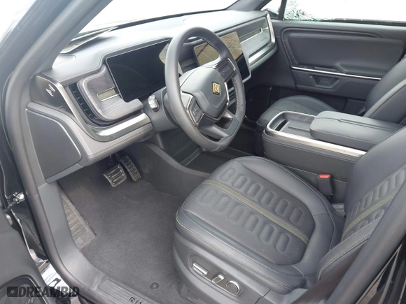 2025 Rivian R1S Adventure with VIN 7PDSGBBA5SN055497, listed as a IAAI auction lot 41695600 with 5,387 mi miles. Bid and sale history available at carsss.com. Image 5.