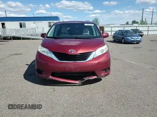 2012 Toyota Sienna LE AAS with VIN 5TDKK3DC7CS195590, listed as a Copart auction lot 57968415 with 201,732 mi miles and Salvage title. Bid and sale history available at DreamBid. Image 14.