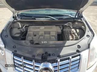 2014 Cadillac SRX Premium Collection z VIN 3GYFNGE32ES573872, wystawiony jako Copart lot #49871955 z przebiegiem 119 362 mil mil oraz Szkody całkowita. Historia ofert i sprzedaży dostępna na DreamBid. Obrazek 13.