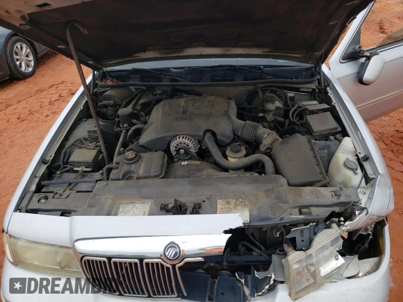 1999 Mercury Grand Marquis LS z VIN 2MEFM75W3XX617388, wystawiony jako Copart lot #58811195 z przebiegiem 162 600 mil mil oraz Szkoda całkowita • Salvage title. Historia ofert i sprzedaży dostępna na DreamBid. Obrazek 11.