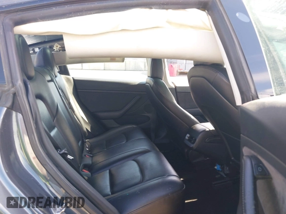 2022 Tesla Model 3 with VIN 5YJ3E1EA1NF142713, listed as a IAAI auction lot 42027630 with 112,557 mi miles. Bid and sale history available at carsss.com. Image 8.