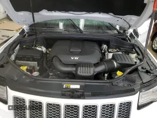 2015 Jeep Grand Cherokee Summit with VIN 1C4RJFJG9FC794992, listed as a Copart auction lot 42790355 with 74,044 mi miles and Salvage Title. Bid and sale history available at DreamBid. Image 13.