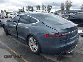 2013 Tesla Model S with VIN 5YJSA1CN8DFP21869, listed as a IAAI auction lot 41772603 with Not provided miles and . Bid and sale history available at DreamBid. Image 3.