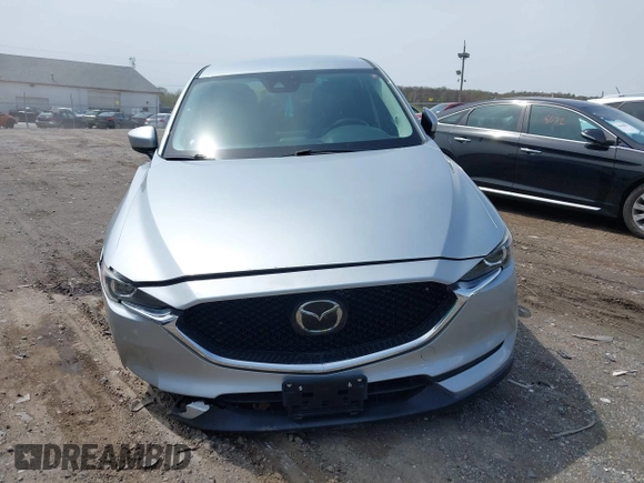 2020 Mazda CX-5 Touring with VIN JM3KFACM9L0785464, listed as a IAAI auction lot 42023311 with 90,062 mi miles and . Bid and sale history available at DreamBid. Image 12.