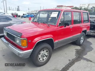 1991 Isuzu Trooper z VIN JACCH58R0M7904092, wystawiony jako IAAI lot #41900283 z przebiegiem 226 780 mil mil oraz . Historia ofert i sprzedaży dostępna na DreamBid. Obrazek 2.