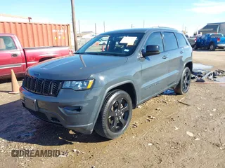 2018 Jeep Grand Cherokee Laredo E with VIN 1C4RJFAG4JC370502, listed as a IAAI auction lot 41342367 with 104,307 mi miles. Bid and sale history available at carsss.com. Image 2.