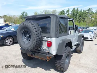2003 Jeep Wrangler Sport z VIN 1J4FA49S73P302278, wystawiony jako IAAI lot #42219582 z przebiegiem 129 089 mil mil oraz . Historia ofert i sprzedaży dostępna na DreamBid. Obrazek 4.