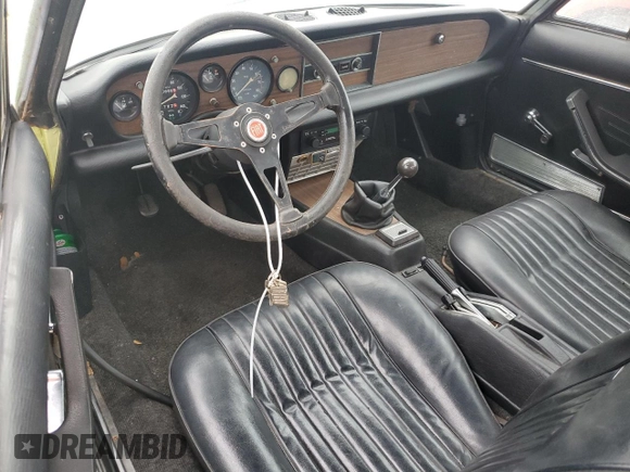 1978 FIAT 124 Spider z VIN 124CS10126825, wystawiony jako Copart lot #75075504 z przebiegiem 94 895 mil mil oraz Szkoda całkowita • Salvage title. Historia ofert i sprzedaży dostępna na DreamBid. Obrazek 8.