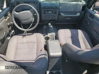 2002 Jeep Wrangler Sport with VIN 1J4FA49S02P721457, listed as a Copart auction lot 61726855 with 76,191 mi miles and Salvage title. Bid and sale history available at DreamBid. Image 8.