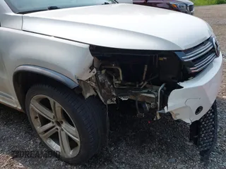 2014 Volkswagen Tiguan SEL with VIN WVGAV3AX7EW022239, listed as a IAAI auction lot 42381670 with 180,729 mi miles and . Bid and sale history available at DreamBid. Image 17.