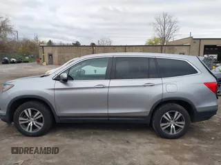 2017 Honda Pilot EX-L with VIN 5FNYF6H5XHB014067, listed as a IAAI auction lot 42083742 with 143,043 mi miles and . Bid and sale history available at DreamBid. Image 14.