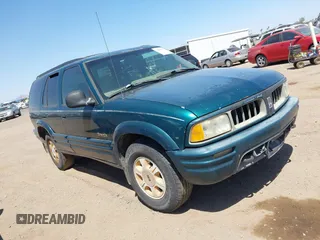 1996 Oldsmobile Bravada z VIN 1GHDT13W5T2711291, wystawiony jako IAAI lot #42502672 z przebiegiem 219 062 mil mil oraz . Historia ofert i sprzedaży dostępna na DreamBid. Obrazek 1.