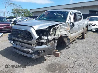 2018 Toyota Tacoma SR z VIN 3TMCZ5AN7JM156092, wystawiony jako IAAI lot #41642391 z przebiegiem 65 805 mil mil oraz . Historia ofert i sprzedaży dostępna na DreamBid. Obrazek 22.