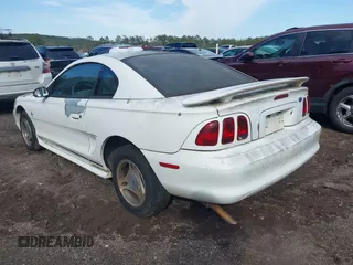 1997 Ford Mustang with VIN 1FALP4040VF200826, listed as a IAAI auction lot 41555969 with 82,134 mi miles. Bid and sale history available at carsss.com. Image 3.
