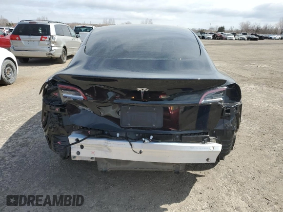 2021 Tesla Model 3 Standard Range Plus with VIN 5YJ3E1EA7MF053663, listed as a Copart auction lot 51982265 with 90,529 mi miles and Salvage Title. Bid and sale history available at DreamBid. Image 6.