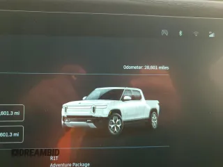 2022 Rivian R1T Adventure z VIN 7FCTGAAA9NN014280, wystawiony jako Copart lot #87908175 z przebiegiem 28 601 mil mil oraz Szkody całkowita. Historia ofert i sprzedaży dostępna na DreamBid. Obrazek 9.