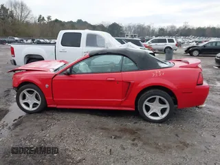 1999 Ford Mustang GT z VIN 1FAFP45XXXF127807, wystawiony jako IAAI lot #41302411 z przebiegiem 156 680 mil mil oraz . Historia ofert i sprzedaży dostępna na DreamBid. Obrazek 15.