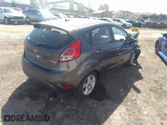 2018 Ford Fiesta SE with VIN 3FADP4EJ0JM141953, listed as a IAAI auction lot 38529613 with 74,502 mi miles and . Bid and sale history available at DreamBid. Image 4.