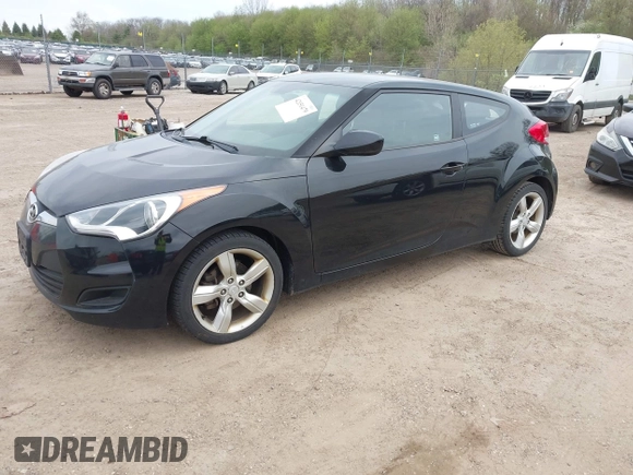 2013 Hyundai Veloster w/Gray Int with VIN KMHTC6AD6DU179826, listed as a IAAI auction lot 42151479 with 82,643 mi miles. Bid and sale history available at carsss.com. Image 2.