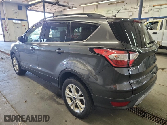 2018 Ford Escape SE z VIN 1FMCU9GD0JUC61682, wystawiony jako Copart lot #59105625 z przebiegiem 85 146 mil mil oraz Czysty tytuł • Clean title. Historia ofert i sprzedaży dostępna na DreamBid. Obrazek 2.