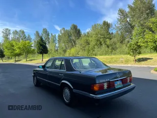 1986 Mercedes-Benz 560 with VIN WDBCA39D0GA203068, listed as a Copart auction lot 56704555 with 107,817 mi miles and Clean Title. Bid and sale history available at DreamBid. Image 3.