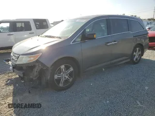 2012 Honda Odyssey Touring с VIN 5FNRL5H92CB130561, выставлен на аукционе Copart как лот 64688495 с пробегом 206 852 миль миль и Списание • Salvage title. История ставок и продаж доступна на DreamBid. Изображение 1.