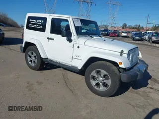 2017 Jeep Wrangler Sahara z VIN 1C4AJWBG0HL614930, wystawiony jako IAAI lot #41678887 z przebiegiem 83 539 mil mil oraz . Historia ofert i sprzedaży dostępna na DreamBid. Obrazek 1.