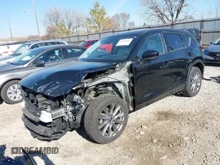 2021 Mazda CX-5 Grand Touring with VIN JM3KFBDM0M0468081, listed as a IAAI auction lot 41894411 with 54,664 mi miles. Bid and sale history available at carsss.com. Image 2.