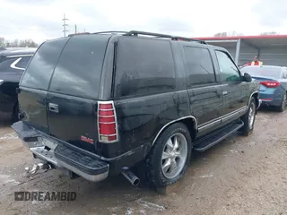1998 GMC Yukon with VIN 1GKEC13R8WJ711255, listed as a IAAI auction lot 41457304 with 291,211 mi miles. Bid and sale history available at carsss.com. Image 4.