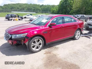 2014 Ford Taurus SEL z VIN 1FAHP2E89EG126922, wystawiony jako IAAI lot #42236235 z przebiegiem 176 917 mil mil oraz . Historia ofert i sprzedaży dostępna na DreamBid. Obrazek 2.