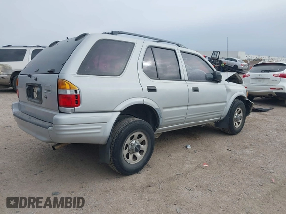1999 Isuzu Rodeo S with VIN 4S2CK58W4X4358898, listed as a IAAI auction lot 41360738 with 184,948 mi miles and . Bid and sale history available at carsss.com. Image 4.