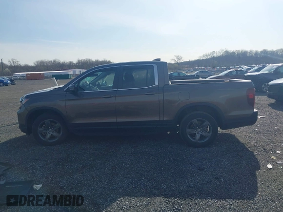 2022 Honda Ridgeline RTL z VIN 5FPYK3F51NB038239, wystawiony jako IAAI lot #41937070 z przebiegiem 39 012 mil mil oraz . Historia ofert i sprzedaży dostępna na DreamBid. Obrazek 14.
